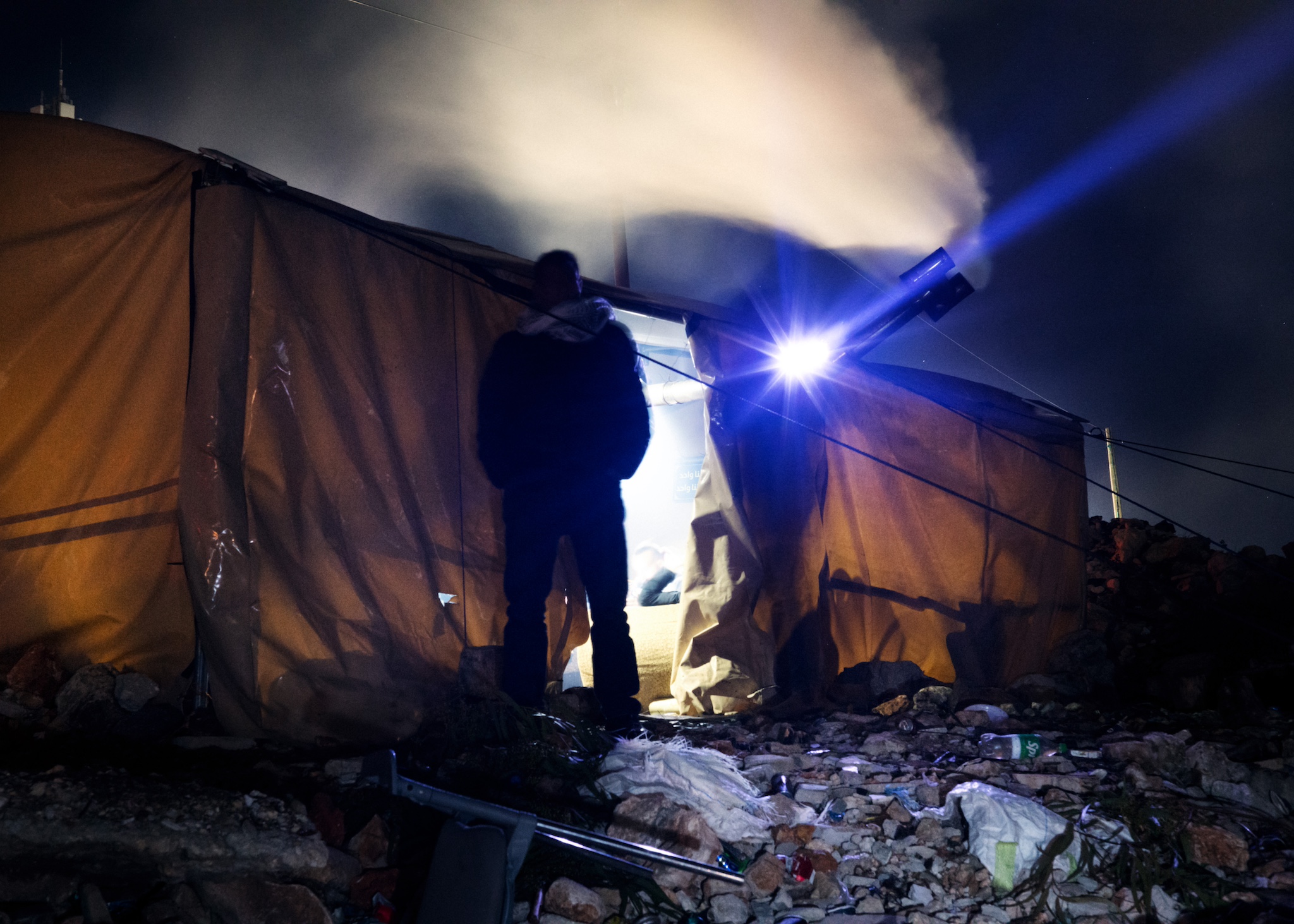 https://newyorkwarcrimes.com/media/pages/as-settler-violence-escalates-against-sinjil-these-night-watchers-protect-their-village/3b42f07bb0-1776364998/14-tent.jpg