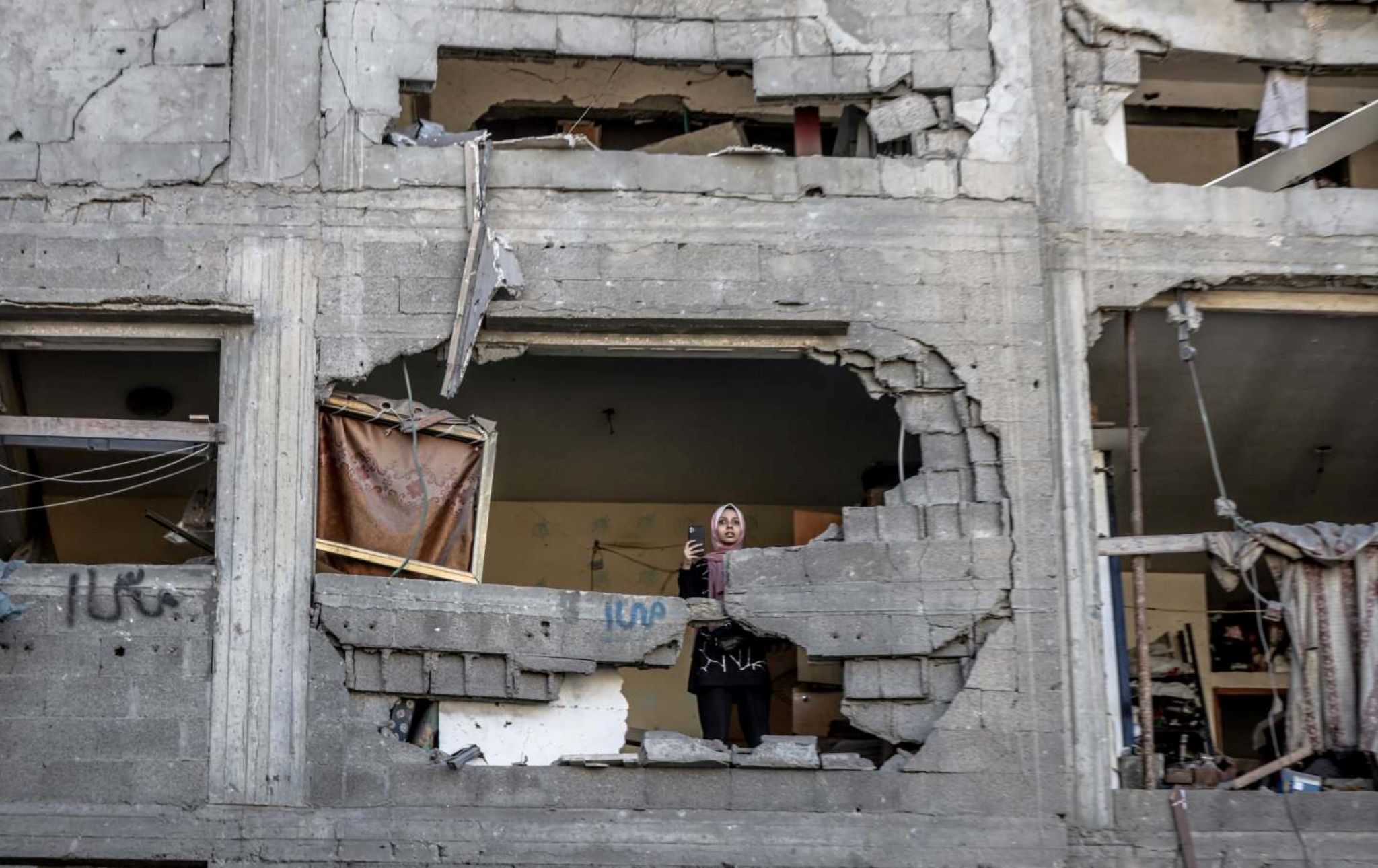 https://newyorkwarcrimes.com/media/pages/if-i-must-starve/e908aac554-1759774753/woman-alone-in-a-gaza-building.jpg