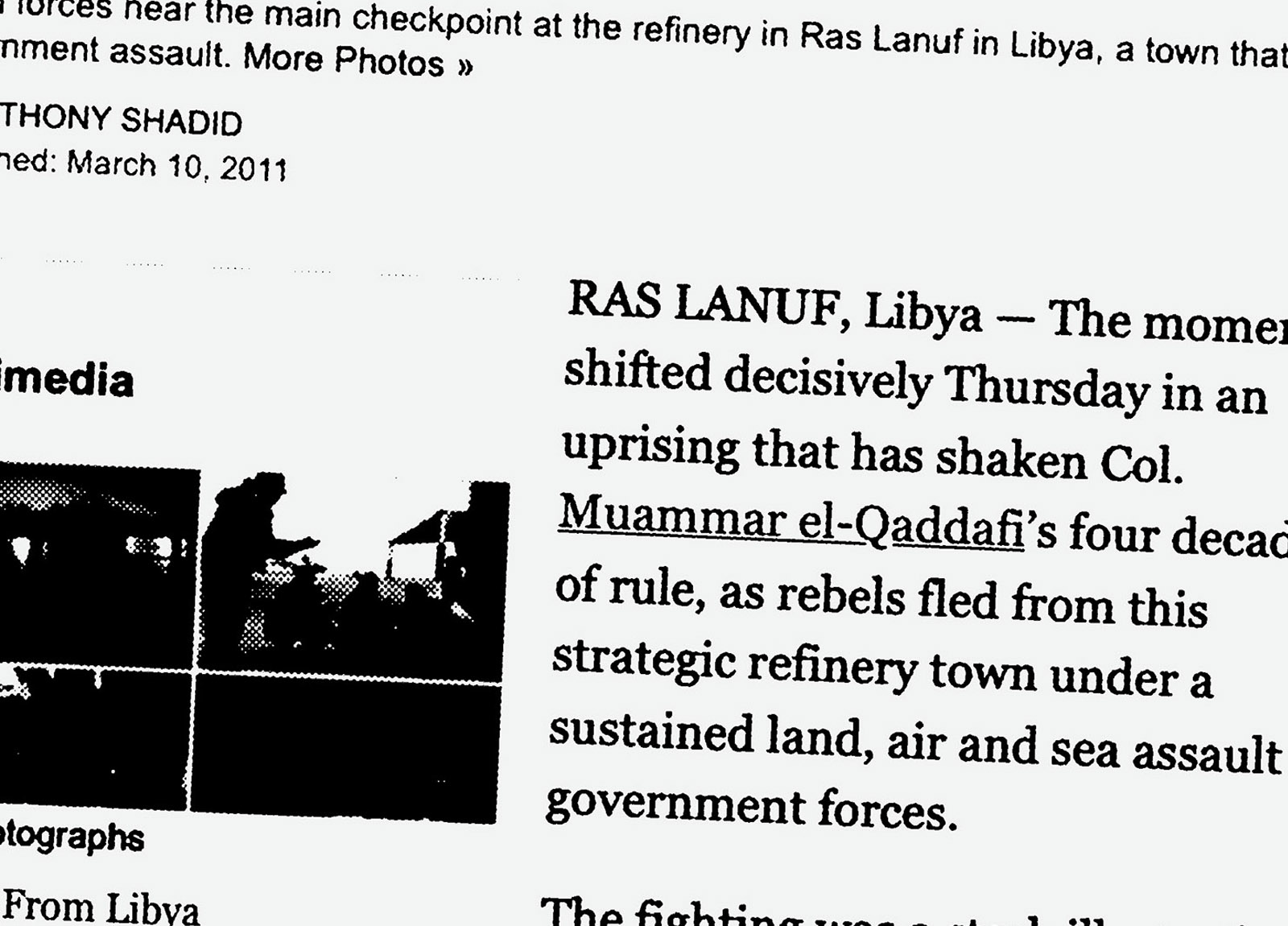 Illustration:
A New York Times article from 2011, taken from its website, is blown up so that it extends beyond the edges of the frame. The first sentences of the article read: “The moment shifted decisively Thursday in an uprising that has shaken Col. Muammar el-Qaddafi’s four decades of rule, as rebels fled from this strategic refinery town under a sustained land, air and sea assault on government forces.”